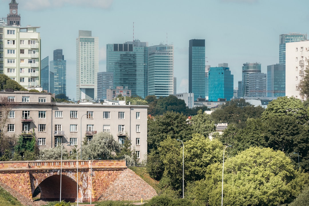 A view of a city with a bridge in the foreground